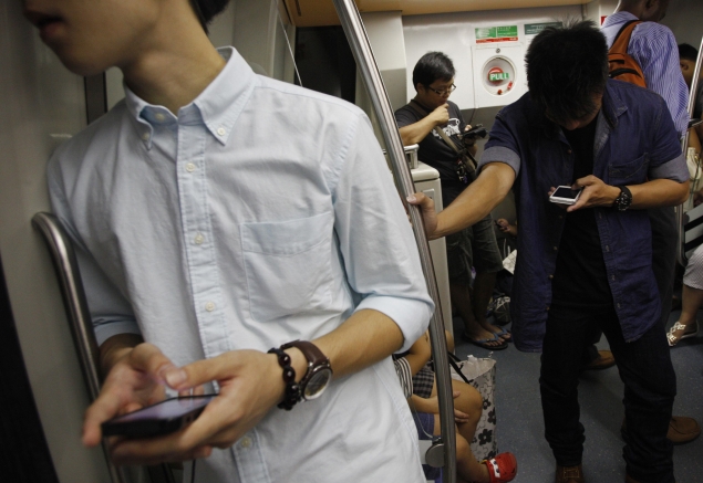 Man using phone on train